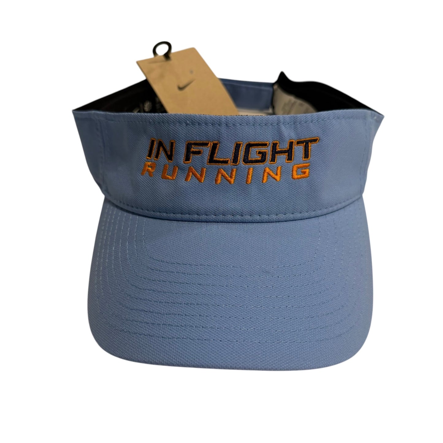 In Flight Running light blue Nike Dry-Fit performance visor with orange embroidered text and a pre-curved bill.