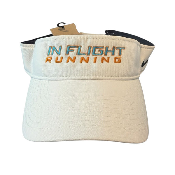 White Nike Dry-Fit performance running visor with "IN FLIGHT RUNNING" embroidered in orange and blue. Features a pre-curved bill and black Nike Swoosh.