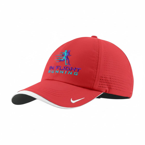 Red Nike Dri-FIT running cap with perforated panels and In Flight Running logo. Features adjustable closure.
